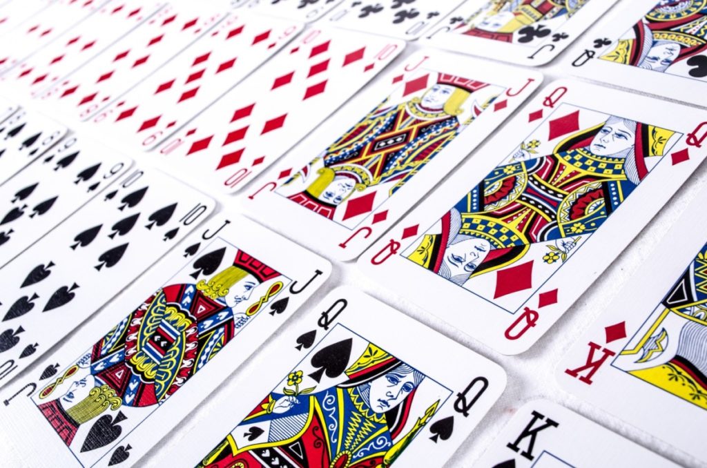 There are lots of puzzles you can make that just involve a set of playing cards... Maybe certain cards are missing, or your players have to count how many are in any particular suit.